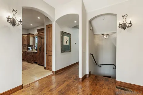 a view of a patio with couches table and chairs with potted plants
