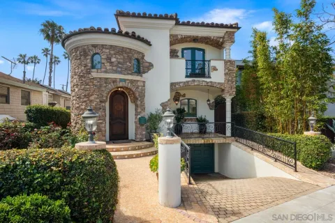 a front view of a house with fountain
