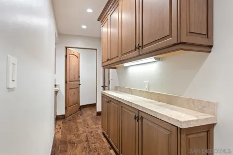 a spacious bedroom with a bed and a flat screen tv