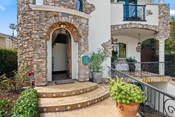 a kitchen with stainless steel appliances granite countertop a sink a stove and a wooden floors
