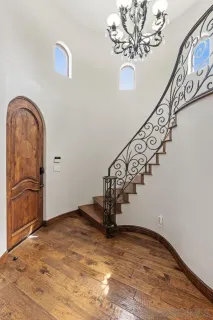 a living room with furniture a fireplace and a window