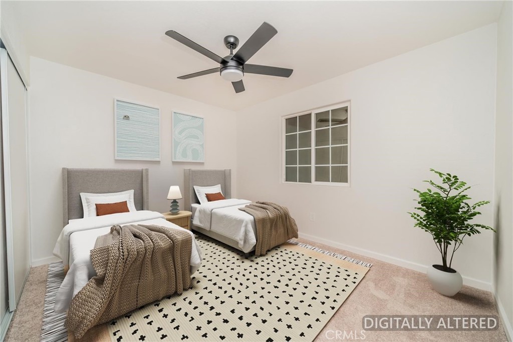 Bedroom 1 (Disclaimer: Some images have been digitally enhanced with virtual staging to illustrate potential room layouts and furnishings. Actual property condition and features may vary. Buyer to verify all information independently).