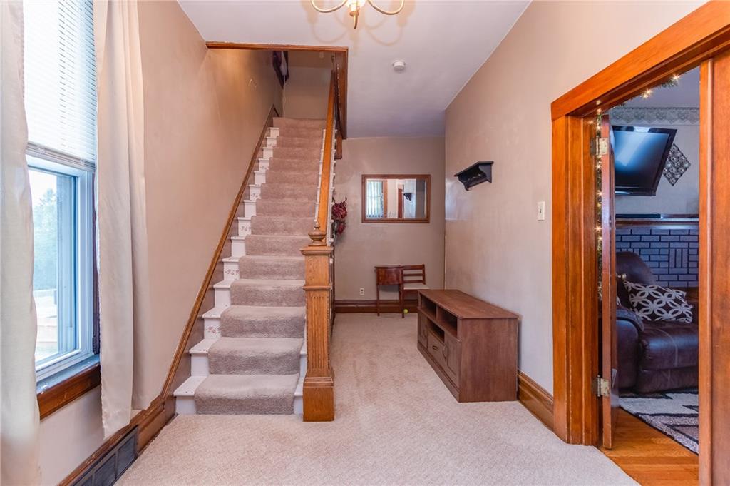 550 Virginia Avenue Rochester, PA 15074 - Photo 14 of 24 a view of hallway with stairs and furniture