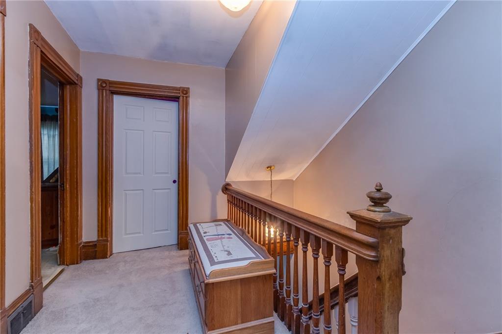 550 Virginia Avenue Rochester, PA 15074 - Photo 15 of 24 a view of staircase with railing and white walls