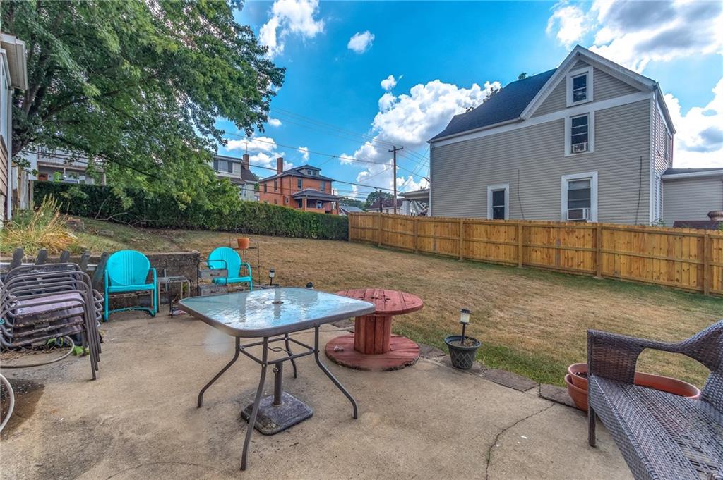 550 Virginia Avenue Rochester, PA 15074 - Photo 21 of 24 a backyard of a house with table and chairs