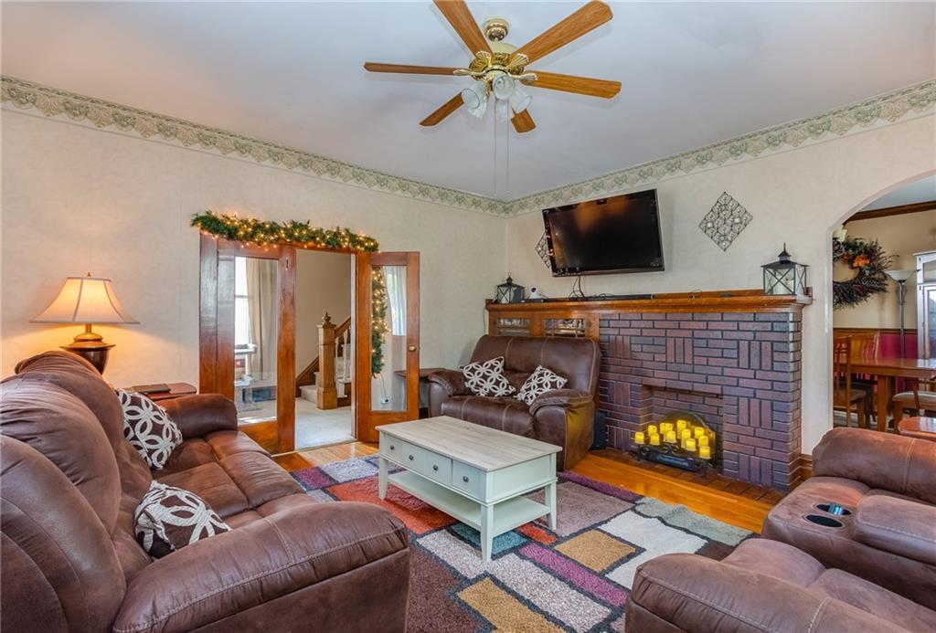 550 Virginia Avenue Rochester, PA 15074 - Photo 3 of 24 a living room with furniture and a fireplace