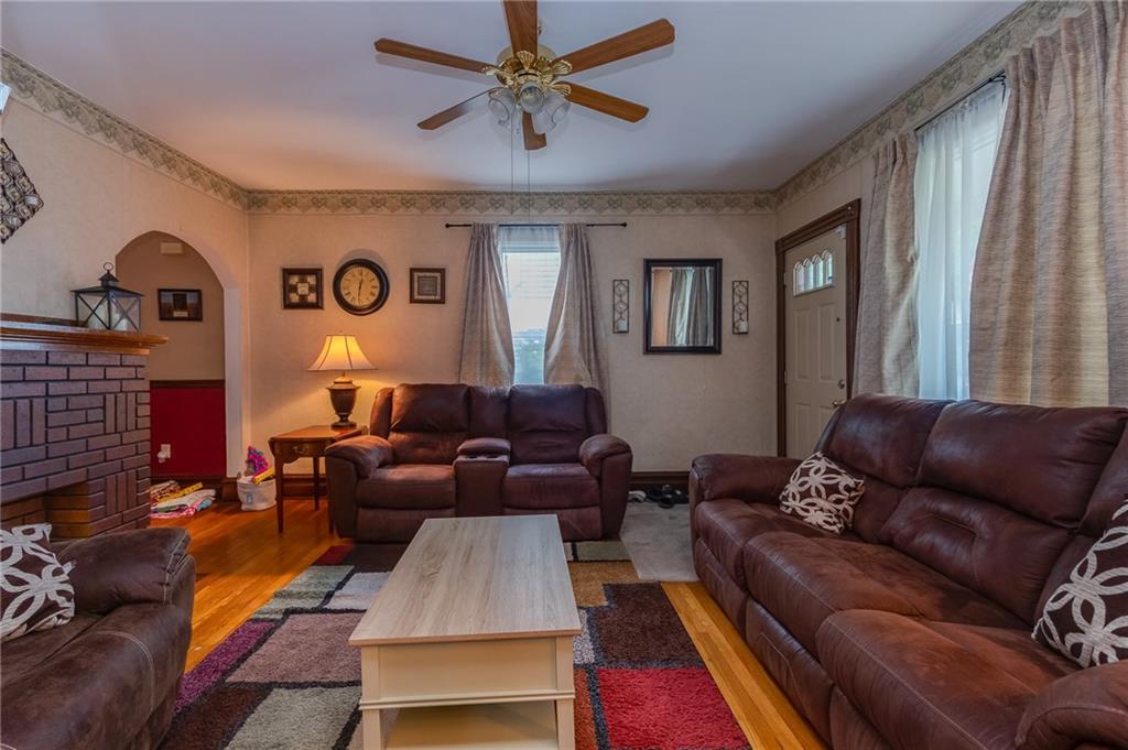 550 Virginia Avenue Rochester, PA 15074 - Photo 5 of 24 a living room with furniture and a large window