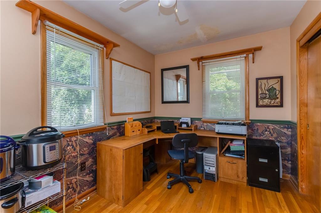 550 Virginia Avenue Rochester, PA 15074 - Photo 10 of 24 a view of a workspace with furniture and a window
