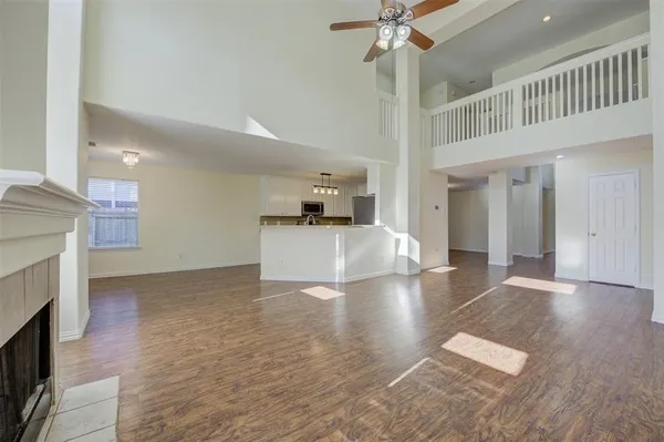 a view of a kitchen with a sink and a fireplace