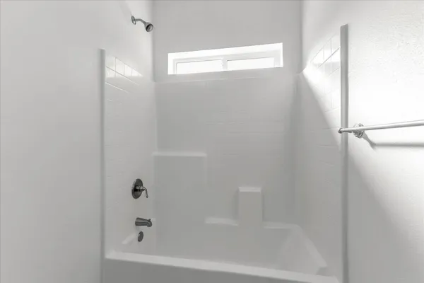 a close up of a bathtub in a bathroom