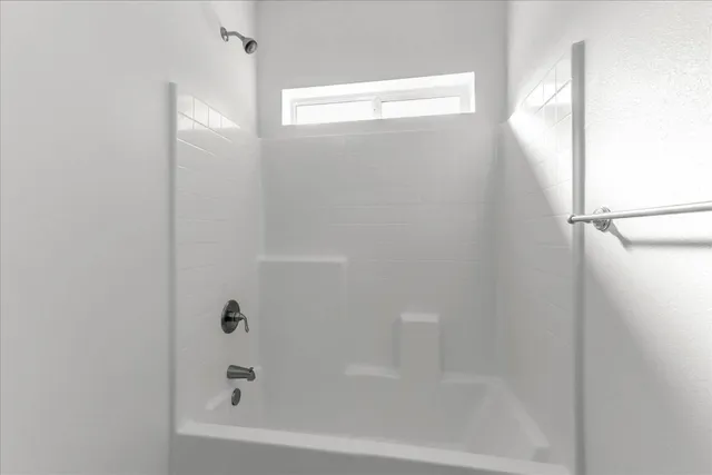 a close up of a bathtub in a bathroom