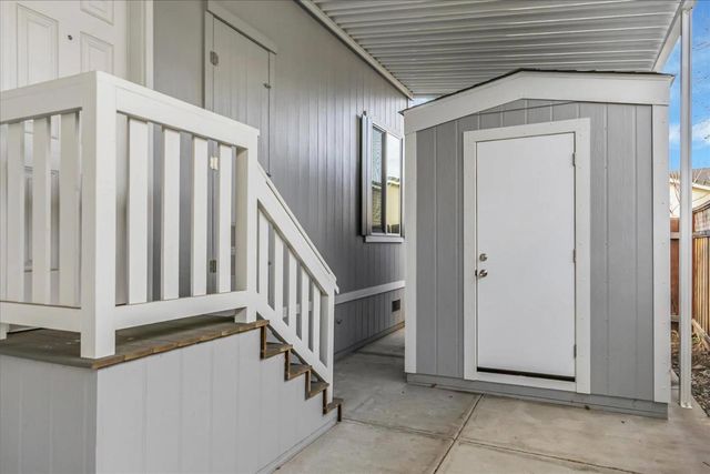 a view of a hallway with staircase