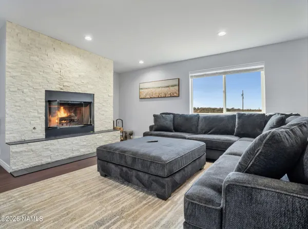 a living room with couches and a fireplace