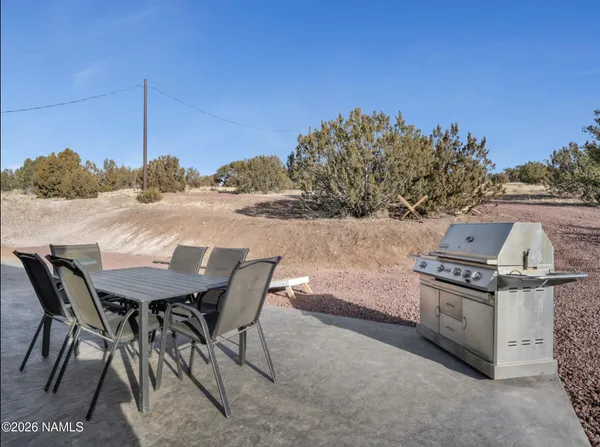 a view of a chairs and table on the terrace