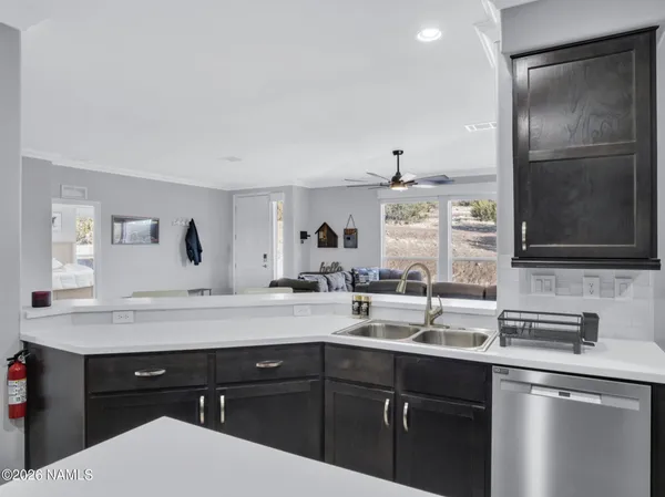 a kitchen with a sink and cabinets