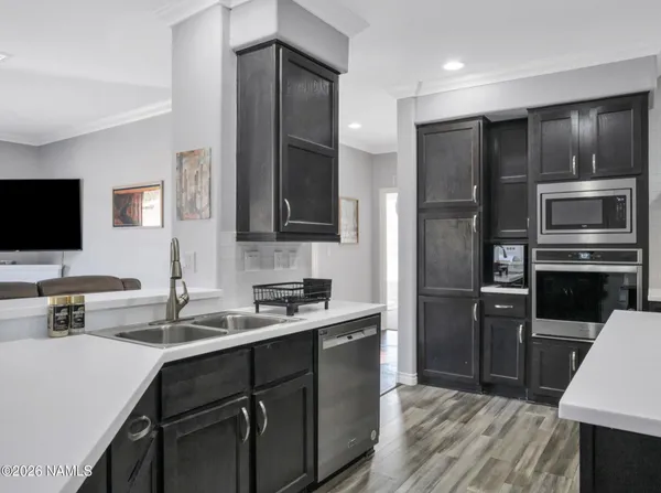 a kitchen with a refrigerator sink and microwave