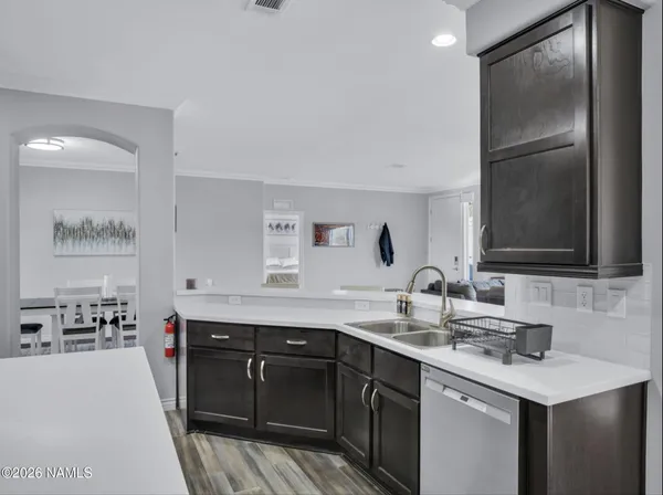 a kitchen with a sink stove and refrigerator