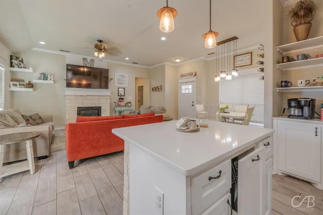 a view of kitchen with sink microwave and stove
