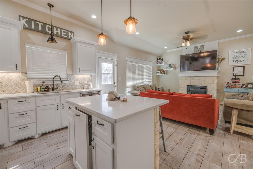 625 Jarrell Court Tuscola, TX 79562 - Photo 12 of 32 a kitchen with cabinets a sink and a stove
