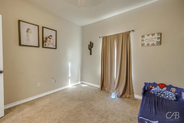 a bathroom with a granite countertop sink a toilet and a mirror