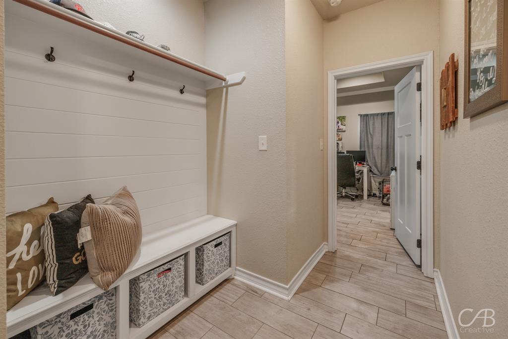 625 Jarrell Court Tuscola, TX 79562 - Photo 22 of 32 a view of a hallway and a livingroom with furniture