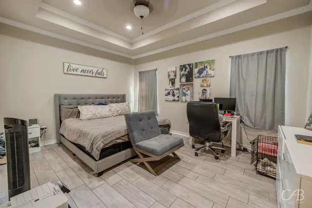 a bathroom with a tub a sink and a window