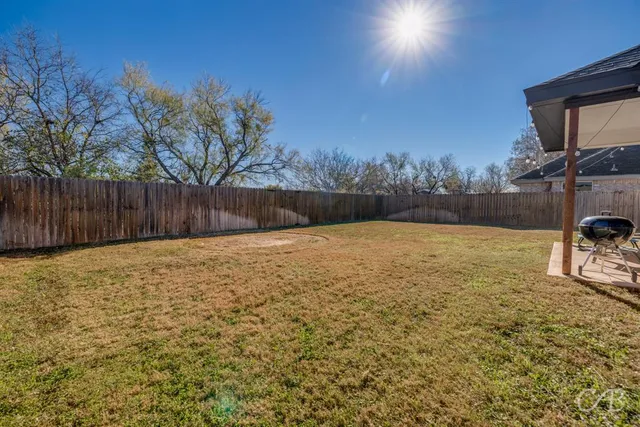 a view of a yard with a slide