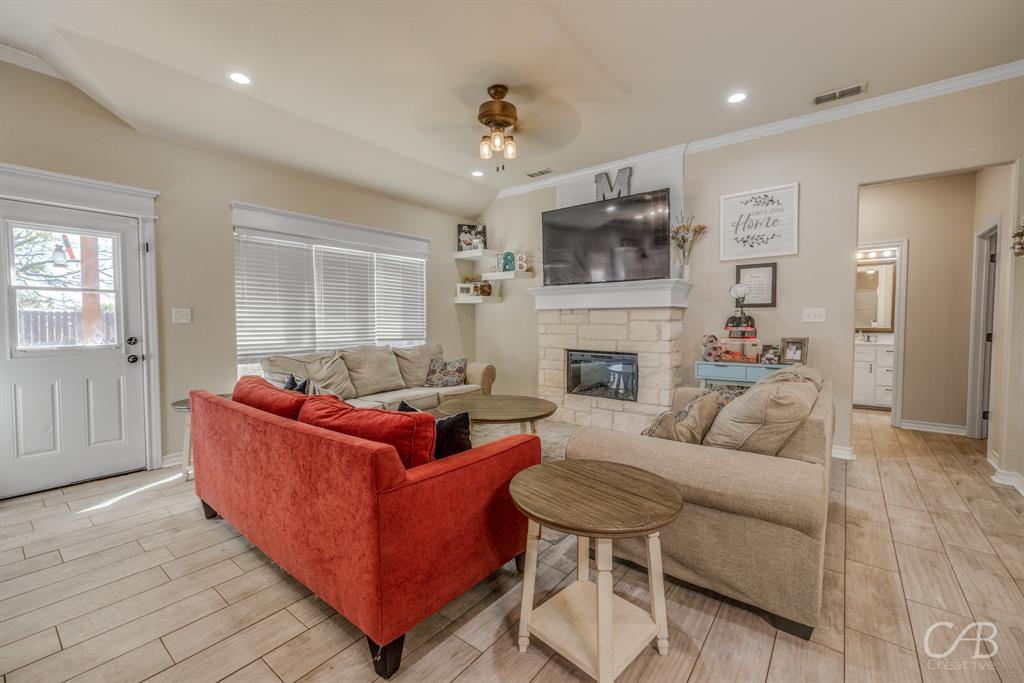 625 Jarrell Court Tuscola, TX 79562 - Photo 5 of 32 a living room with furniture and a fireplace