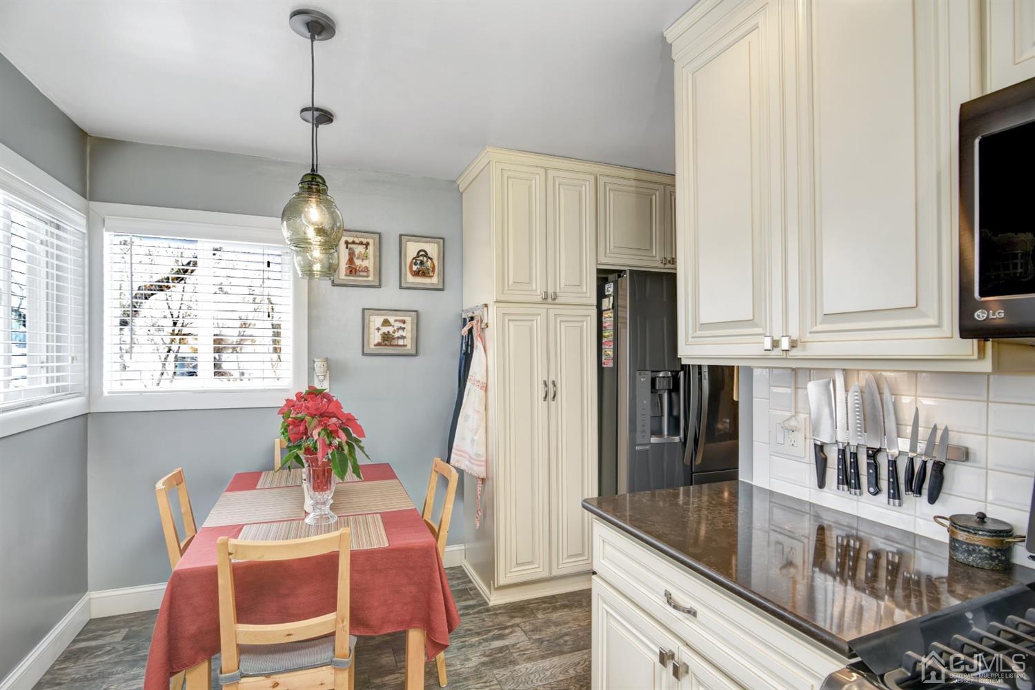 24 Racetrack Road East Brunswick, NJ 08816 - Photo 14 of 37 a kitchen with stainless steel appliances granite countertop a refrigerator and a stove top oven