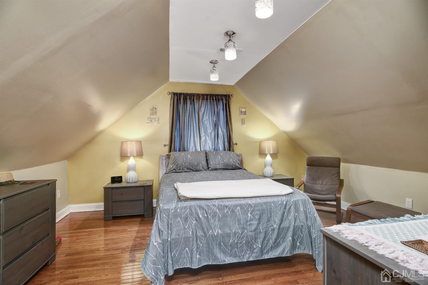 24 Racetrack Road East Brunswick, NJ 08816 - Photo 25 of 37 a bedroom with a bed and wooden floor