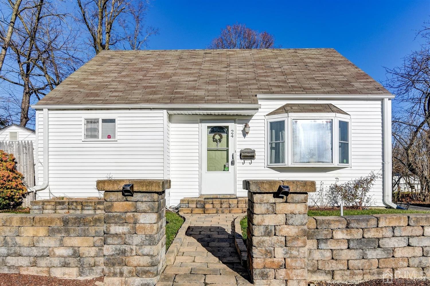 24 Racetrack Road East Brunswick, NJ 08816 - Photo 3 of 37 a front view of a house with a yard