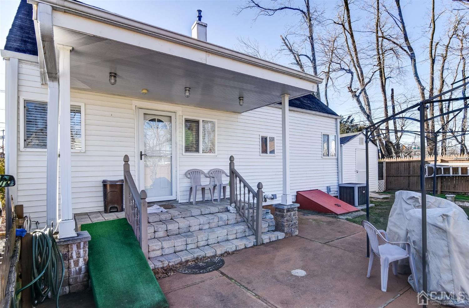 24 Racetrack Road East Brunswick, NJ 08816 - Photo 34 of 37 a view of a house with a chairs in patio