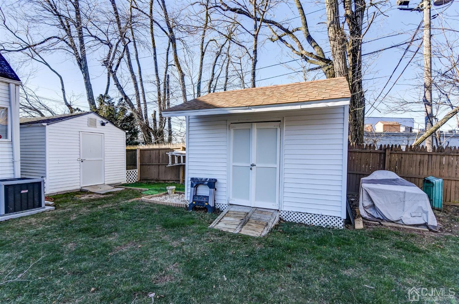 24 Racetrack Road East Brunswick, NJ 08816 - Photo 37 of 37 a backyard of a house with table and chairs