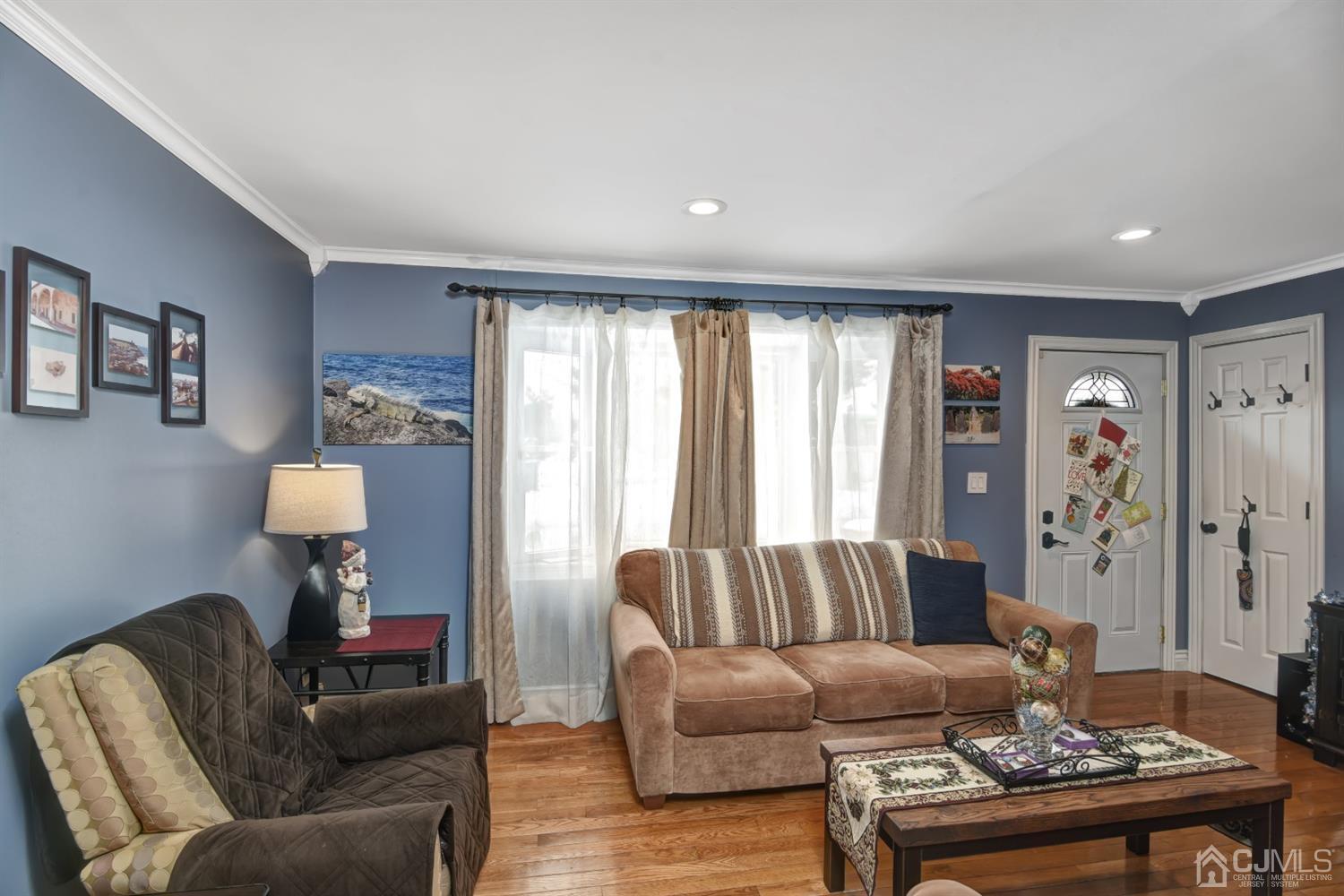 24 Racetrack Road East Brunswick, NJ 08816 - Photo 8 of 37 a living room with furniture and a large window