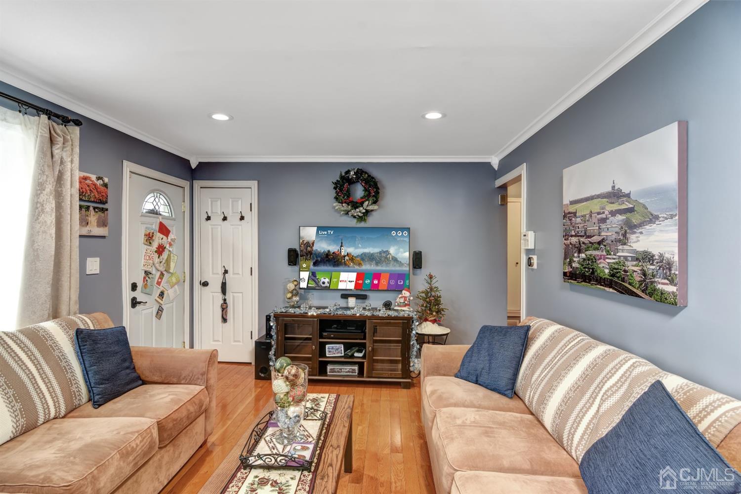 24 Racetrack Road East Brunswick, NJ 08816 - Photo 9 of 37 a living room with furniture and a flat screen tv