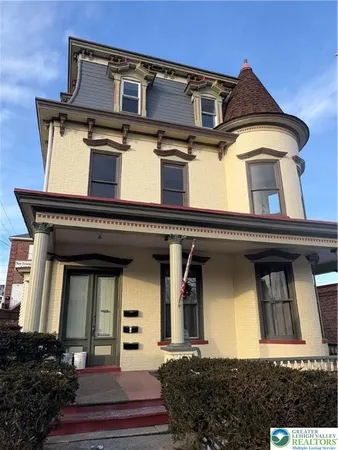 front view of a house with a small yard