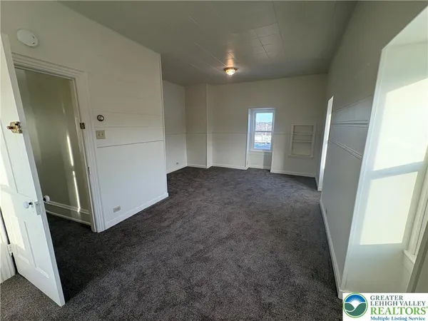 a view of empty room with windows