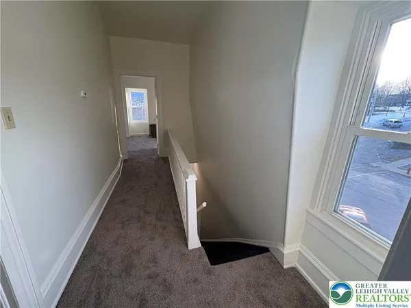 a view of an empty room and window