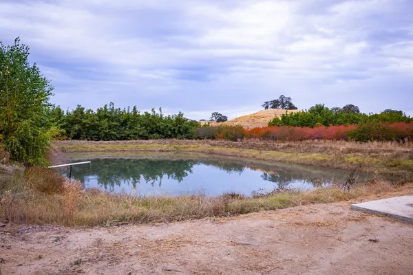 a view of lake with green space