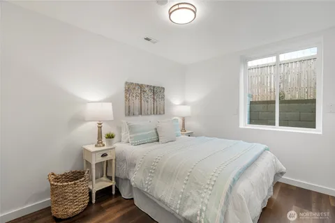 a bedroom with bed and window