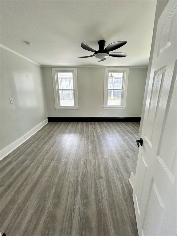16 North Street West Springfield, MA 01089 - Photo 11 of 28 a view of a big room with wooden floor and windows