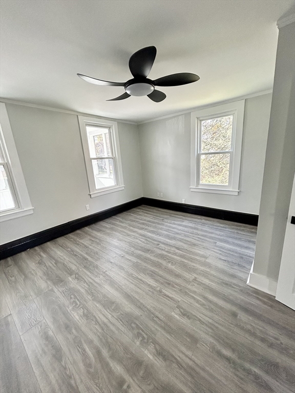 16 North Street West Springfield, MA 01089 - Photo 12 of 28 a view of an empty room with wooden floor and a window