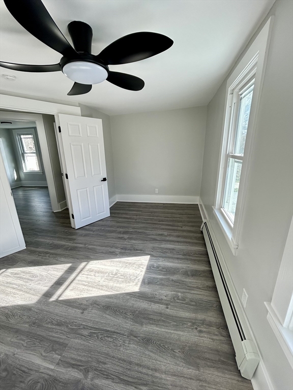 16 North Street West Springfield, MA 01089 - Photo 16 of 28 a view of an empty room with wooden floor and window