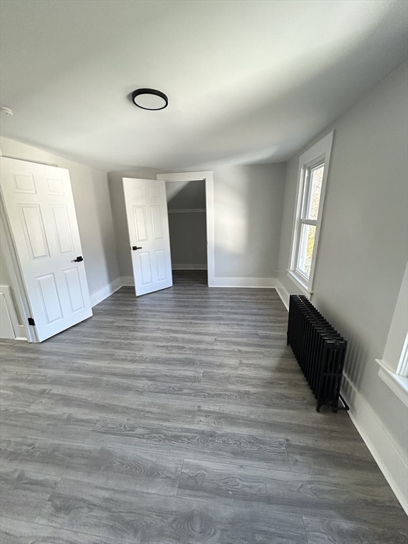16 North Street West Springfield, MA 01089 - Photo 20 of 28 an empty room with wooden floor and windows