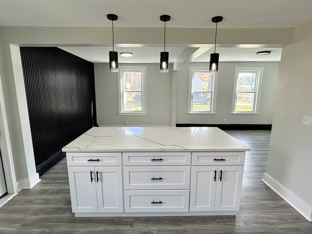 16 North Street West Springfield, MA 01089 - Photo 2 of 28 a kitchen with a stove and a wooden floor
