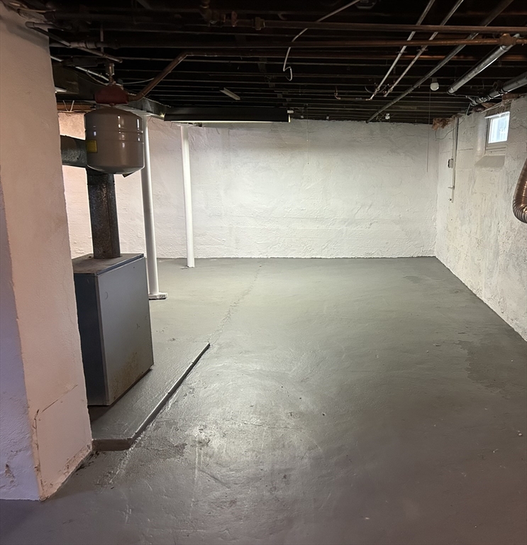 16 North Street West Springfield, MA 01089 - Photo 27 of 28 a view of a empty room with wooden walls