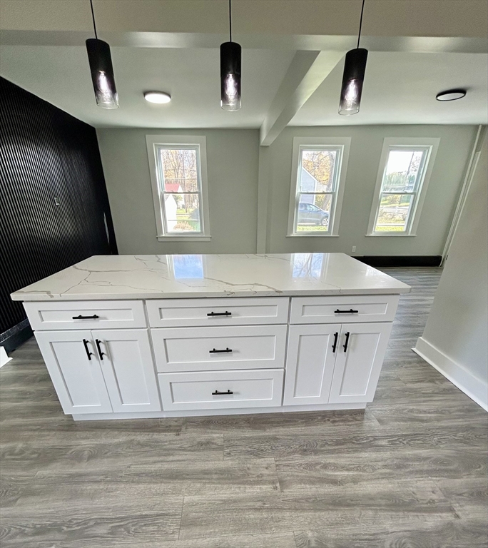 16 North Street West Springfield, MA 01089 - Photo 6 of 28 a view of kitchen cabinets and a wooden floor
