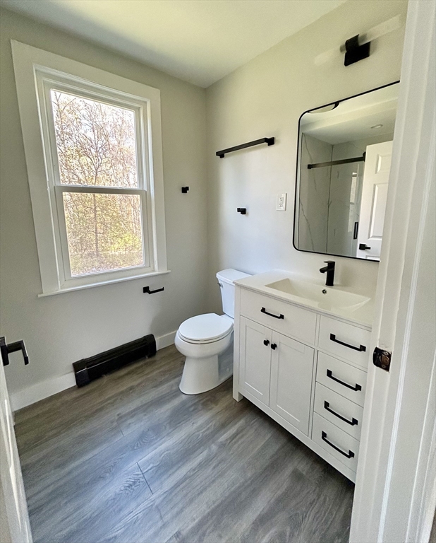16 North Street West Springfield, MA 01089 - Photo 9 of 28 a bathroom with a toilet sink and mirror