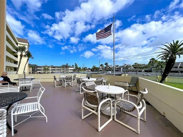 a view of a terrace with sitting area