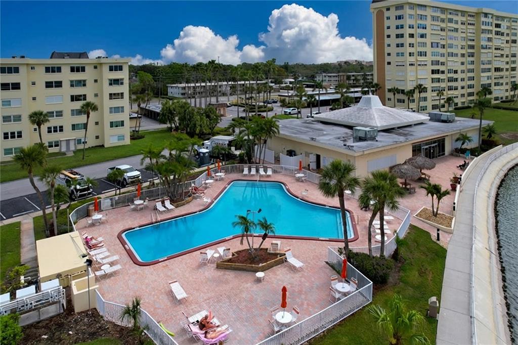 4650 Cove Circle, Unit 209 St. Petersburg, FL 33708 - Photo 23 of 54 a view of a swimming pool with outdoor space